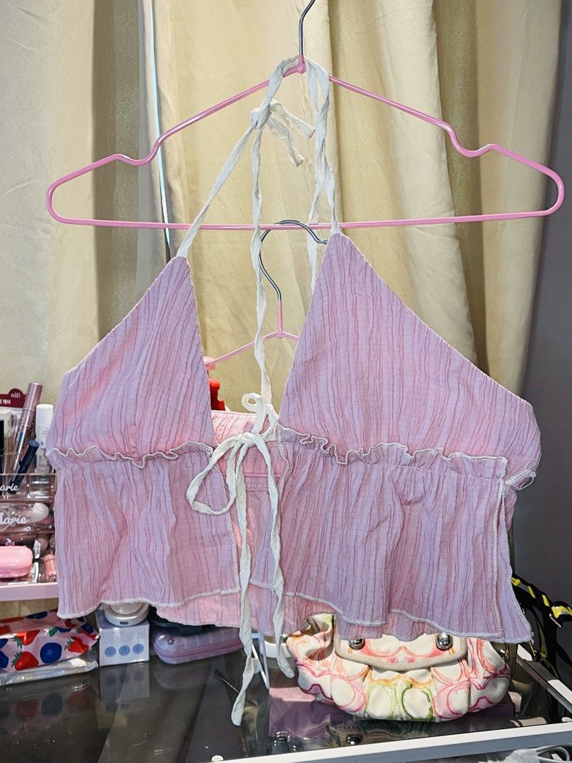 SHEIN Pink Halter Crop Top Size XS (Category: Sleeveless) located in San Mateo. Submitted by precious.03 (Listing ID 1464998280, Image 1). Description: - Brand: Shein - Size: XS (EU 34, US 2) - Brand new with tag attached - Color: Pink - Material & Design: Light & breezy crinkle texture fabric with self-tie straps at the neck and front - Details: Charming ruffle trim along the bottom hem and edges - Perfect for: Warm weather, beach trips, or casu