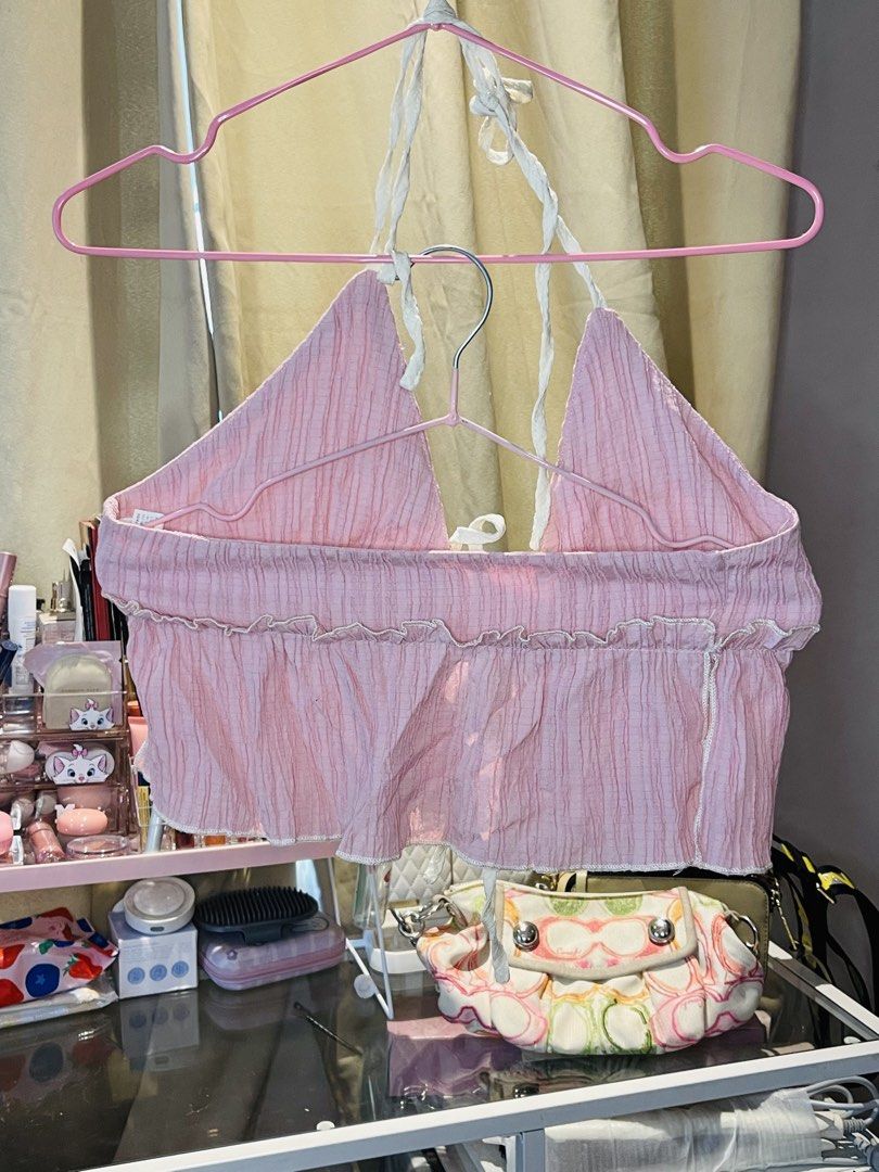 SHEIN Pink Halter Crop Top Size XS (Category: Sleeveless) located in San Mateo. Submitted by precious.03 (Listing ID 1464998280, Image 2). Description: - Brand: Shein - Size: XS (EU 34, US 2) - Brand new with tag attached - Color: Pink - Material & Design: Light & breezy crinkle texture fabric with self-tie straps at the neck and front - Details: Charming ruffle trim along the bottom hem and edges - Perfect for: Warm weather, beach trips, or casu