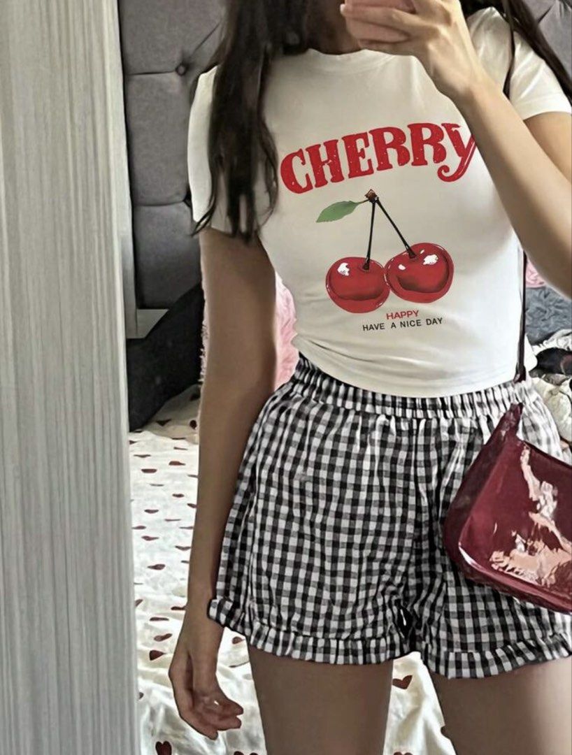 Shein White Cherry Cropped Top Shirt (Category: Shirts) located in Manila. Submitted by dianafayesimbre (Listing ID 1465071053, Image 2). Description: White cropped t-shirt with short sleeves. Red cherry graphic print on the front with 'CHERRY' and 'HAPPY HAVE A NICE DAY' lettering. Crew neckline. Size 13Y from Shein Teen but can fit xxs to small in womens. .