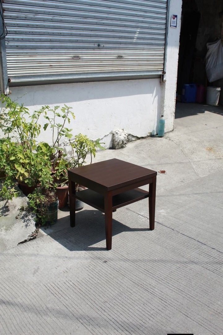 Side Table (Category: Tables & Sets) located in Meycauayan. Submitted by marygracecasimiro (Listing ID 1465164201, Image 3). Description: Dark Brown Side Table with Shelf Minimalist side table in a dark espresso brown finish with a spacious lower shelf for convenient storage. Perfect for living rooms, bedrooms or compact spaces L:19 ¾ • W: 19 ¾ • H: 19 ¾ inches 4,000 pesos only🩷🧡.