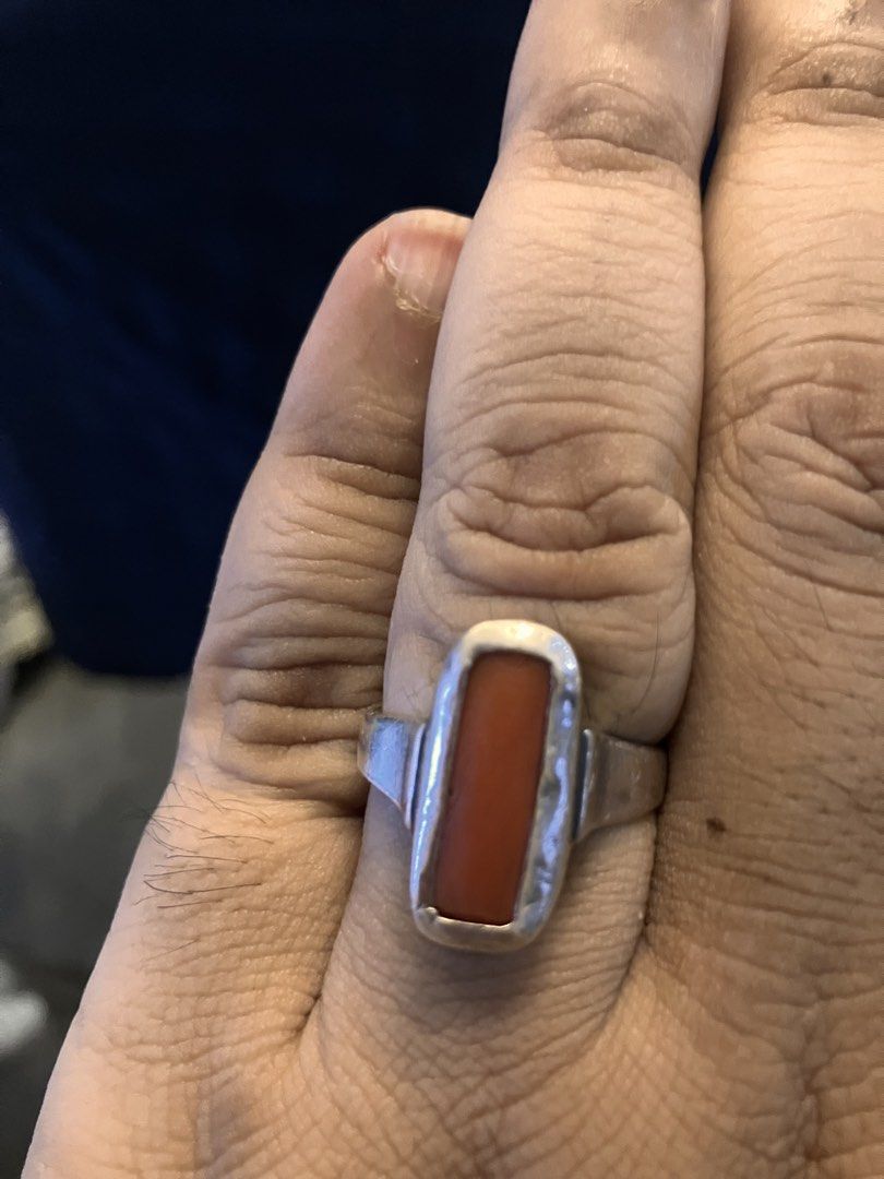 Silver Rectangular Red coral Ring (Category: Rings) located in Kuala Lumpur. Submitted by prithwish296594 (Listing ID 1465063586, Image 3). Description: - Bold silver ring design - Features a striking rectangular red coral (natural) in a bezel setting - Smooth metal band with simple sides - Solid and sturdy construction - Makes a great statement piece on the finger Ring Size : 18 Metal : Silver .