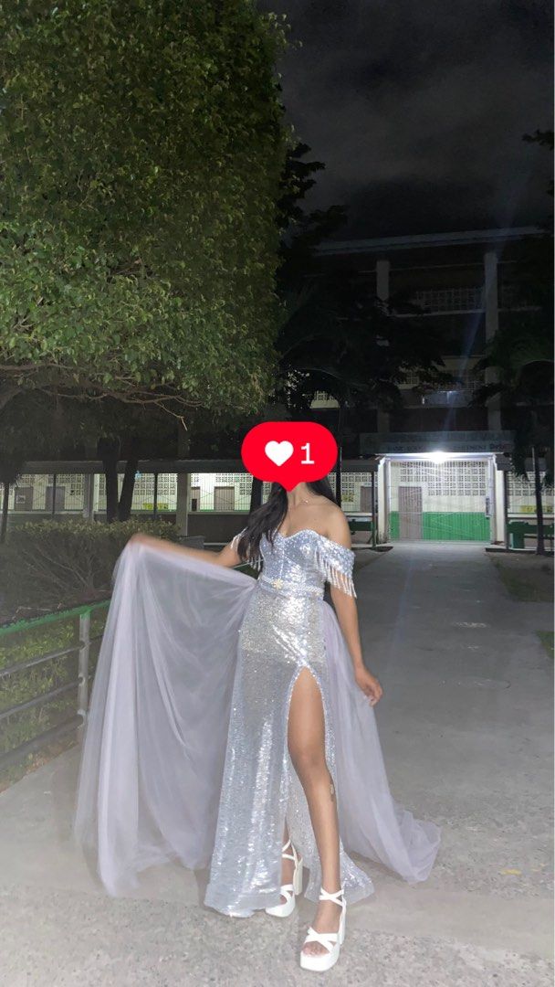Silver Sequin Off-Shoulder Gown with Tulle Train (Category: Evening dresses & gowns) located in Manila. Submitted by brightearth.a59ddb (Listing ID 1465103963, Image 1). Description: body frame: small pwede xs- semi-med since adjustable lack-up back siya once ko lang nagamit ‘to get niyo na pls plssss.