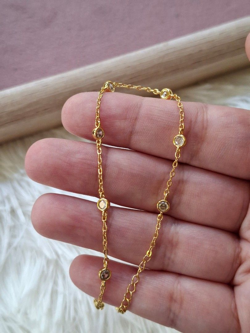 Simple Gold with White Crystals Adjustable Bracelet (Category: Bracelets) located in Dasmarinas. Submitted by danabrie22 (Listing ID 1464991218, Image 3). Description: very well-made, excellent crafstmanship 10/10 condition brand new stainless steel & crystal-colored cubic zirconia stones made in Hongkong.