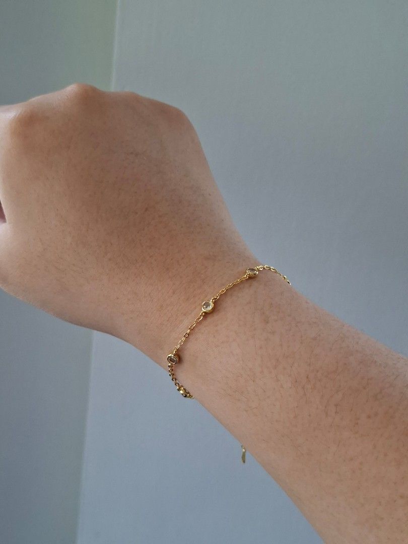 Simple Gold with White Crystals Adjustable Bracelet (Category: Bracelets) located in Dasmarinas. Submitted by danabrie22 (Listing ID 1464991218, Image 2). Description: very well-made, excellent crafstmanship 10/10 condition brand new stainless steel & crystal-colored cubic zirconia stones made in Hongkong.