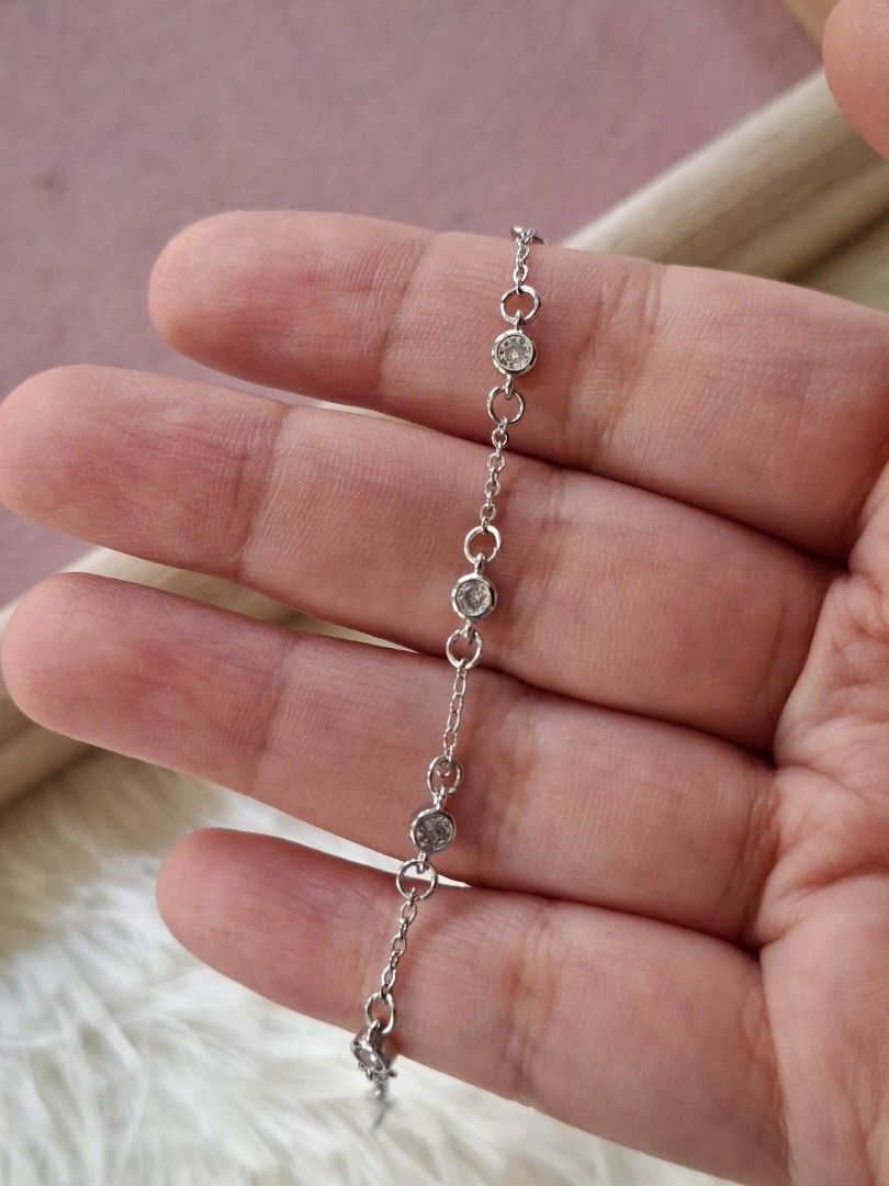 Simple Silver with White Crystals Adjustable Bracelet (Category: Bracelets) located in Dasmarinas. Submitted by danabrie22 (Listing ID 1464990978, Image 3). Description: very well-made, excellent crafstmanship 10/10 condition brand new stainless steel & crystal-colored cubic zirconia stones made in Hongkong.