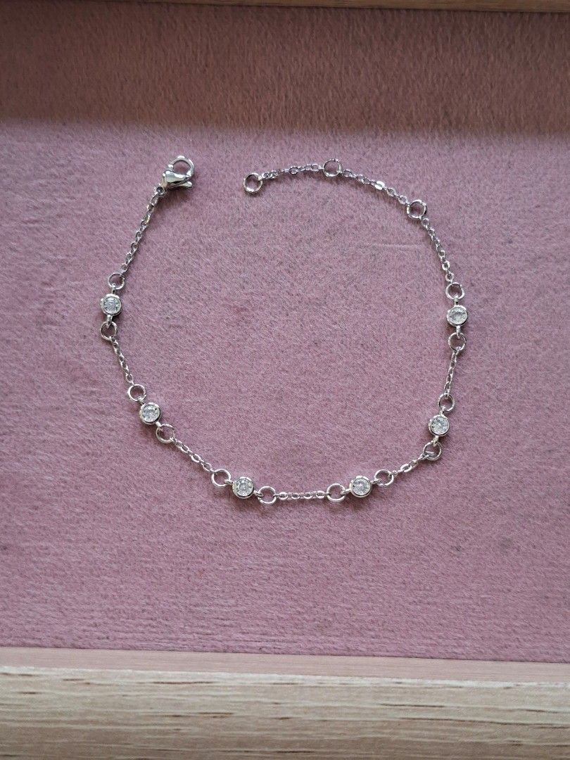 Simple Silver with White Crystals Adjustable Bracelet (Category: Bracelets) located in Dasmarinas. Submitted by danabrie22 (Listing ID 1464990978, Image 1). Description: very well-made, excellent crafstmanship 10/10 condition brand new stainless steel & crystal-colored cubic zirconia stones made in Hongkong.