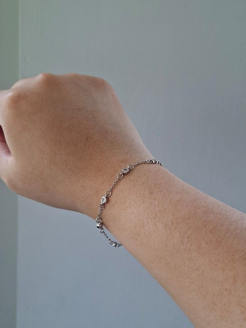 Simple Silver with White Crystals Adjustable Bracelet (Category: Bracelets) located in Dasmarinas. Submitted by danabrie22 (Listing ID 1464990978, Image 2). Description: very well-made, excellent crafstmanship 10/10 condition brand new stainless steel & crystal-colored cubic zirconia stones made in Hongkong.