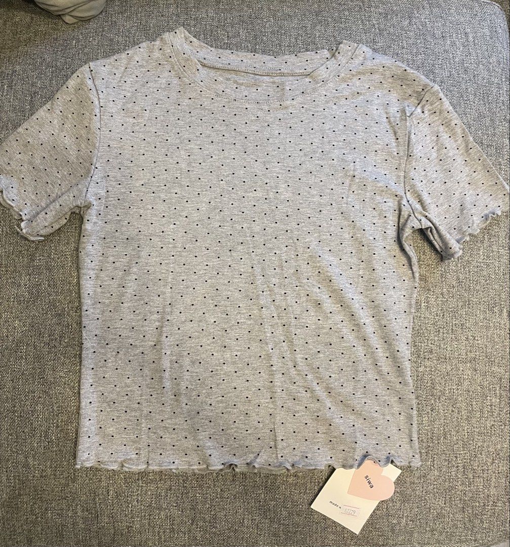 Siwa BKK Polka Lettuce Top (Category: Blouses) located in Quezon City. Submitted by mfordma (Listing ID 1465039878, Image 1). Description: BRAND NEW Originally bought for 540.00 Doing a little closet decluttering! ✨ Letting go of some pieces that are still in great condition and looking for a new home. 🤍 Brand: Siwa Size: Free size Color: Gray Description: - Very stretchable allover black polka dot print - Semi cropped short sleeve tee with roun