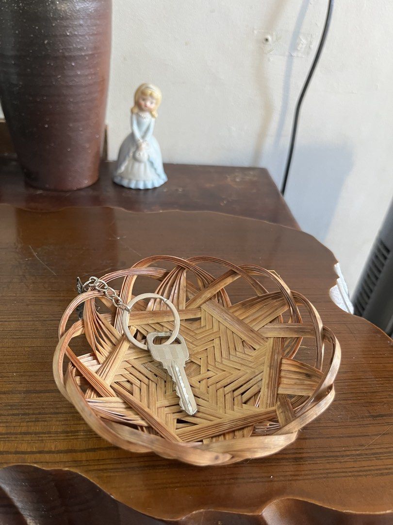 Small Woven Bamboo Basket Tray Storage Dish (Category: Storage Boxes & Baskets) located in Taguig. Submitted by minmin_parker (Listing ID 1465051734, Image 2). Description: - Material: Lightweight natural bamboo with rustic brown tones - Size: Approx. 5 inches across x 2 inches tall - Design: Open patterned rim with a sturdy star-weave base - Uses: Handy catch-all for keys, loose change, or small trinkets on desks and entryway tables - Condition:
