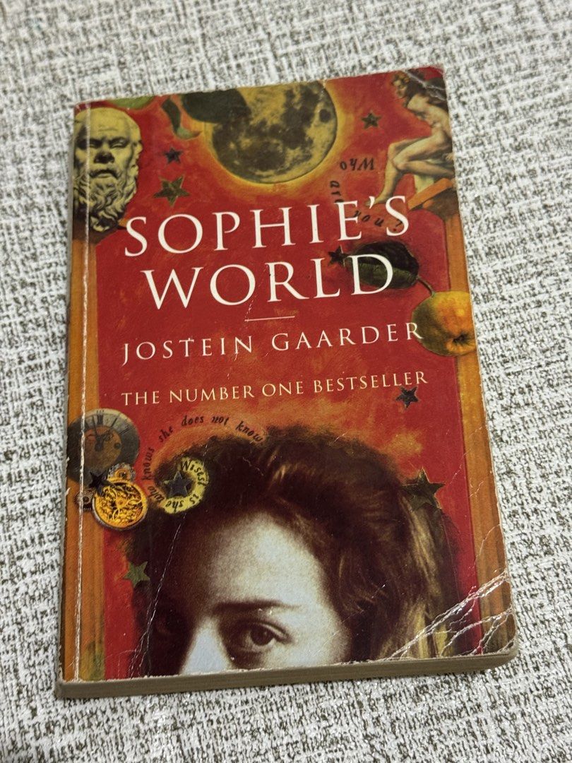Sophie's World by Jostein Gaarder Paperback (Category: Storybooks) located in Cavite. Submitted by yourpahinagirly (Listing ID 1464991008, Image 1). Description: - Title: Sophie's World by Jostein Gaarder - Format: Paperback with classic cover art - Condition: Pre-loved, natural yellowing of pages, with creases on the cover corners and spine edge - Readability: 100% readable, clean text - About: A fantastic and engaging introduction to the histor