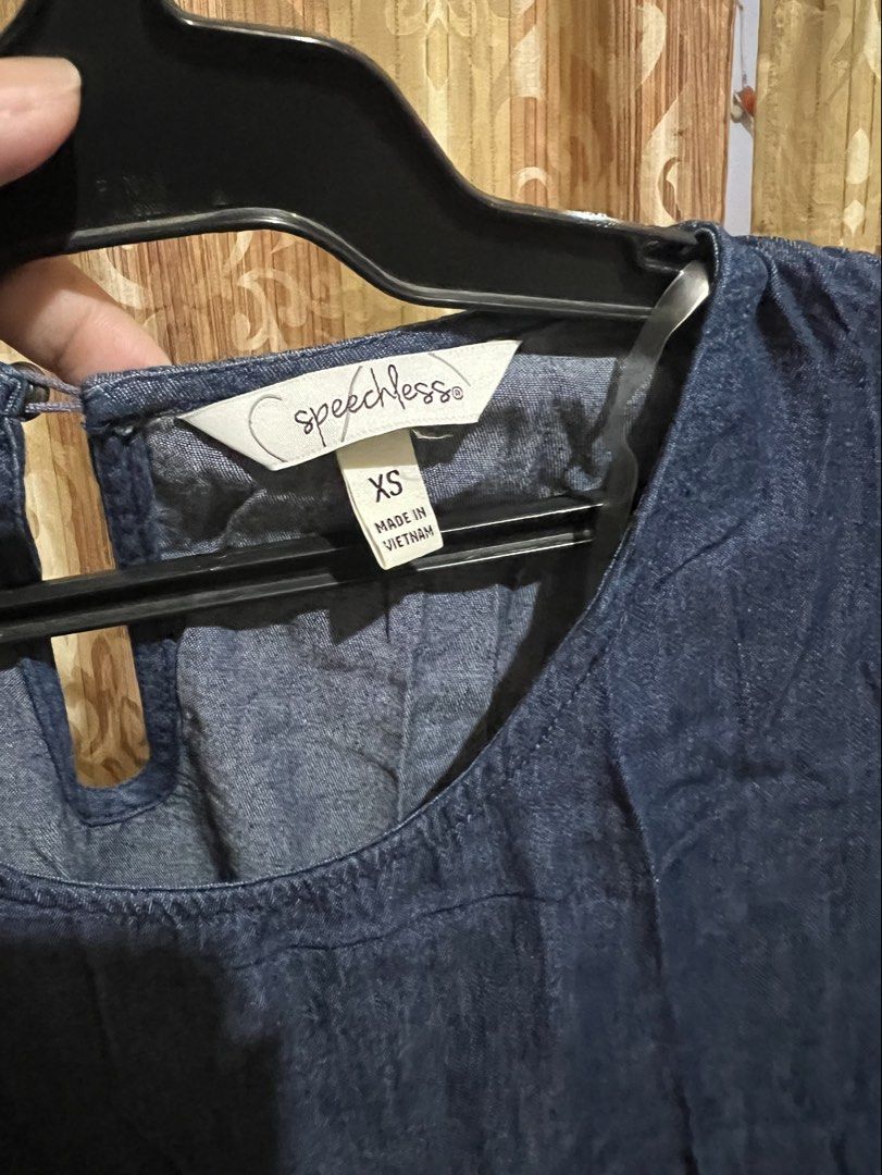 Speechless Denim Tiered Dress XS (Category: Dresses) located in Cabanatuan. Submitted by imported2023 (Listing ID 1465078398, Image 3). Description: - Brand: Speechless - Size: XS (tag attached) - Color: Classic Blue Denim - Material: Made in Vietnam - Design: Tiered skirt, puffed sleeves with elastic cuffs - Neckline: Round neck with keyhole back button closure - Style Tip: Pair with sneakers or sandals for a chic, effortless look!.