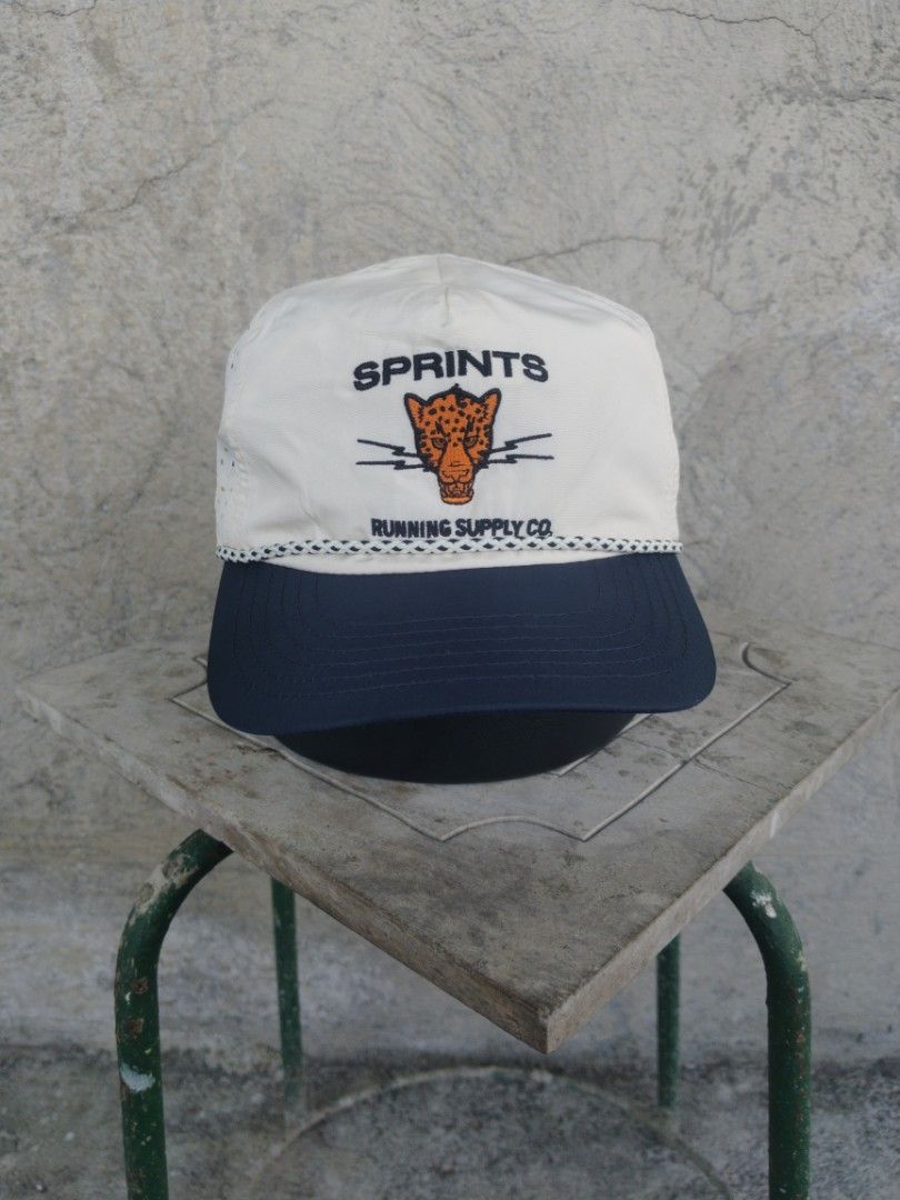 Sprints Running Supply Co. Hat (Category: Caps & Hats) located in Legazpi City. Submitted by genobecollectives (Listing ID 1464974490, Image 1). Description: Sprints Running Supply running hats 400 each plus sf pag aspack 700 free ship - Design: Embroidered leopard and buffalo front panels with contrasting braided rope - Colors: White perforated crown and navy blue brim - Fit: Adjustable snapback closure (One size fits most) - Material: Lightweig
