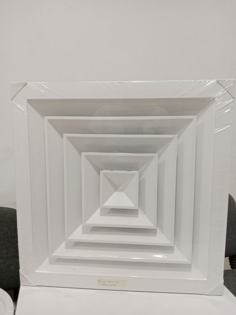 Square Ceiling Diffuser Vent Cover (Category: Bathroom & Kitchen Fixtures) located in Manila. Submitted by cyrenejoye (Listing ID 1464973861, Image 3). Description: - Type: White square ceiling diffuser - Design: Multi-tier louver for even airflow distribution - Condition: Brand new, still in original plastic wrap, zero scratches or dents - Compatibility: Standard size for home and office drop ceilings - Ready for pick-up or shipping!.