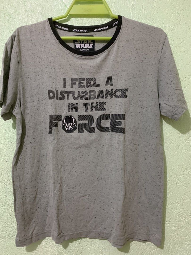 Star Wars Darth Vader T-Shirt (Category: Tshirts & Polo Shirts ) located in Daraga. Submitted by ryrilim (Listing ID 1464998596, Image 1). Description: - Authentic Star Wars merchandise - Color: Heather grey with speckled effect - Front graphic: Darth Vader with "I feel a disturbance in the force" text - Details: Contrasting black ribbed collar and Star Wars branded inner neck taping - Size: Large - Material: Comfortable cotton blend.