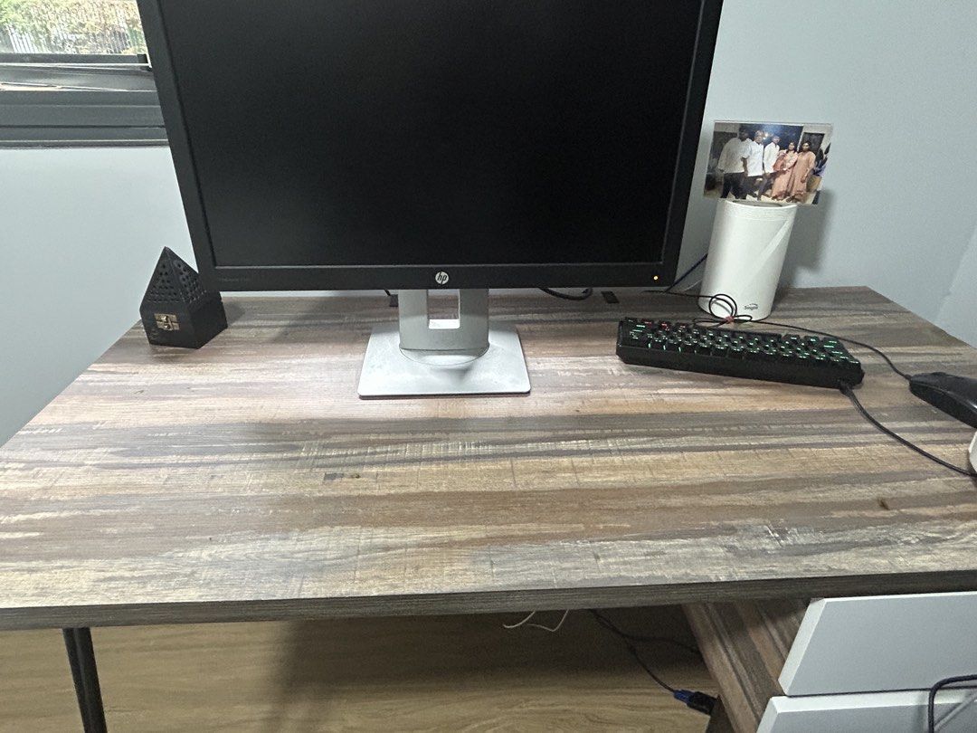 Study table (Category: Tables & Sets) located in Singapore. Submitted by sharr1536 (Listing ID 1465047839, Image 1). Description: - Rustic wooden study desk with stylish weathered grey brown finish - Sturdy build featuring a black metal leg on one side and built-in storage drawers on the other - Spacious top surface easily fits a monitor, keyboard, and daily essentials - Ideal dimensions for bedroom workspaces or cozy home offices - Condition: Mi