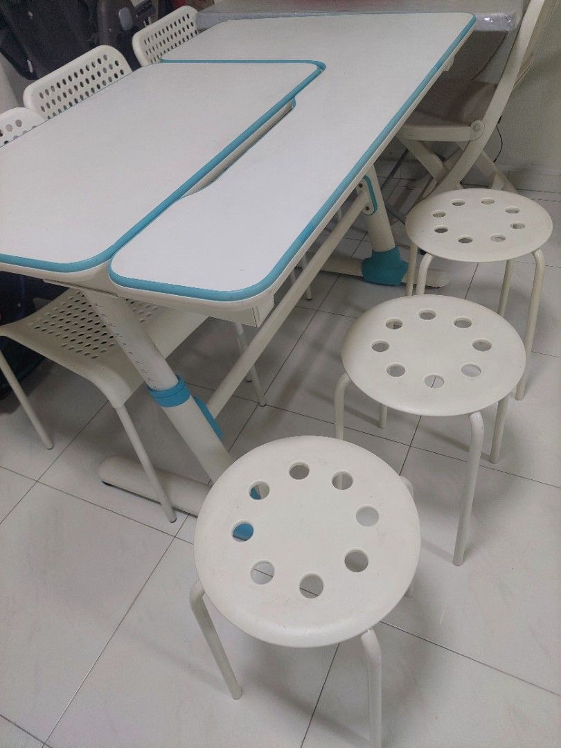 Study Table w Adjustable Height & white Chairs (Category: Tables & Sets) located in Singapore. Submitted by chrisanton (Listing ID 1460783995, Image 2). Description: - White and blue study table - Table features a smooth surface - Adjustable height - Ideal for a room or study - Easy to clean.