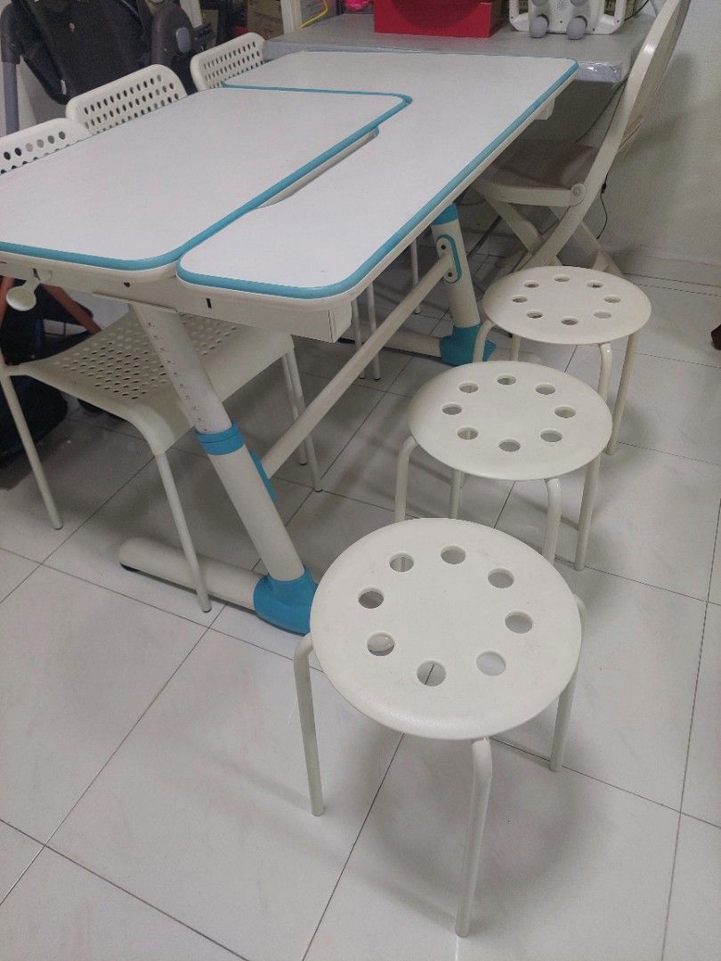 Study Table w Adjustable Height & white Chairs (Category: Tables & Sets) located in Singapore. Submitted by chrisanton (Listing ID 1460783995, Image 1). Description: - White and blue study table - Table features a smooth surface - Adjustable height - Ideal for a room or study - Easy to clean.