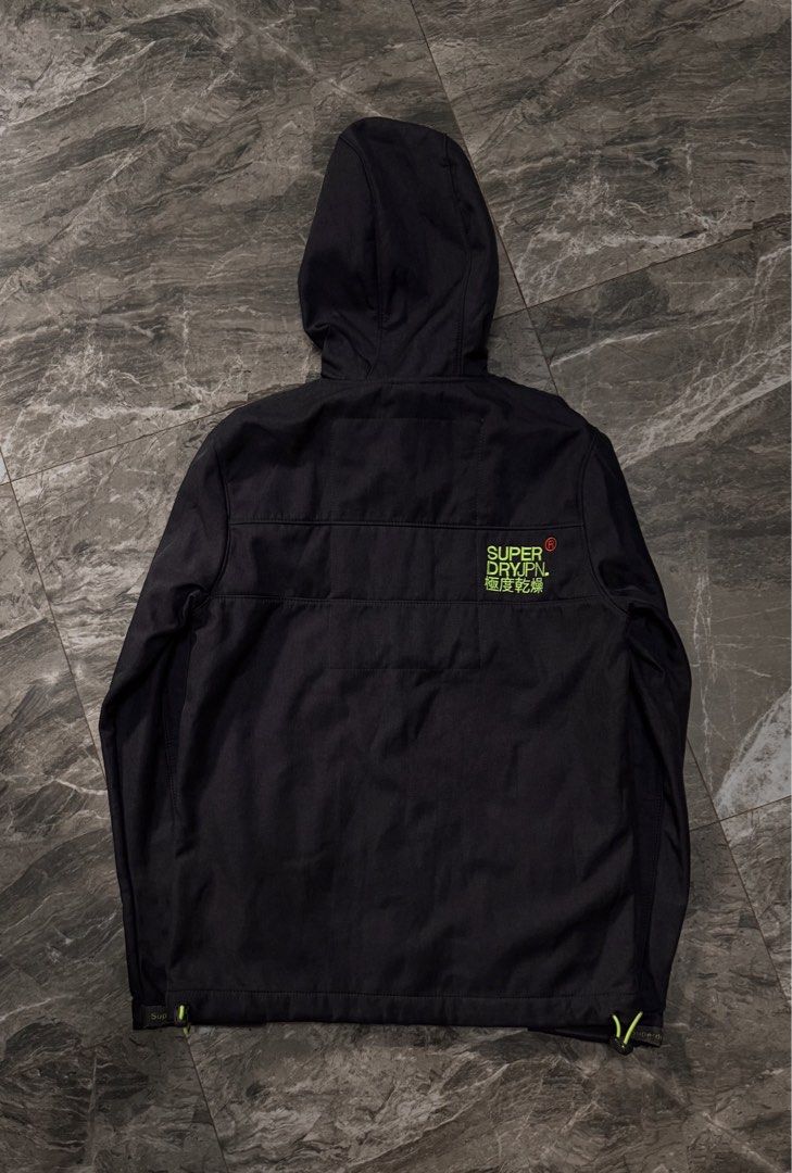 Superdry Neon Lined Hooded Softshell Jacket Black (Category: Coats, Jackets and Outerwear) located in Alaminos. Submitted by outfitcheck.ph (Listing ID 1465109669, Image 3). Description: - Authentic Superdry softshell jacket in sleek black - Warm neon green fleece-lined hood with adjustable drawstrings - Eye-catching neon green front and pocket zippers - Convenient zippered chest pocket for secure storage - Adjustable drawstring hem for a customi