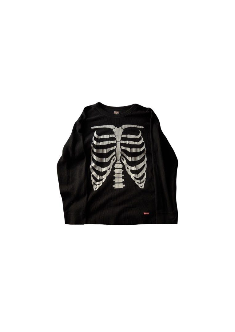 Supreme Skeleton Ribbed Long Sleeve Thermal Black (Category: Longsleeves) located in Cabanatuan. Submitted by archive.stuffz (Listing ID 1464984591, Image 1). Description: - Brand: Supreme - Item: Thermal Long Sleeve Top - Color: Black with white skeleton ribcage & arm graphics - Material: Classic waffle knit texture - Details: Red Supreme box logo near hem, ribbed crew neckline & cuffs - Condition: Great streetwear piece, ideal for cooler weathe