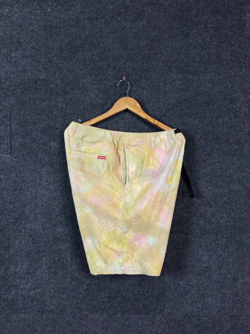Supreme Tie-Dye Corduroy Shorts (Category: Shorts) located in Antipas. Submitted by charsonaesthetics (Listing ID 1464984059, Image 1). Description: - Brand: Supreme - Material: Soft corduroy fabric - Design: Pastel tie-dye wash in yellow and pink tones - Features: Elastic waistband with adjustable black web belt, side pockets, and rear welt pocket - Branding: Classic Supreme red box logo tag on the rear.