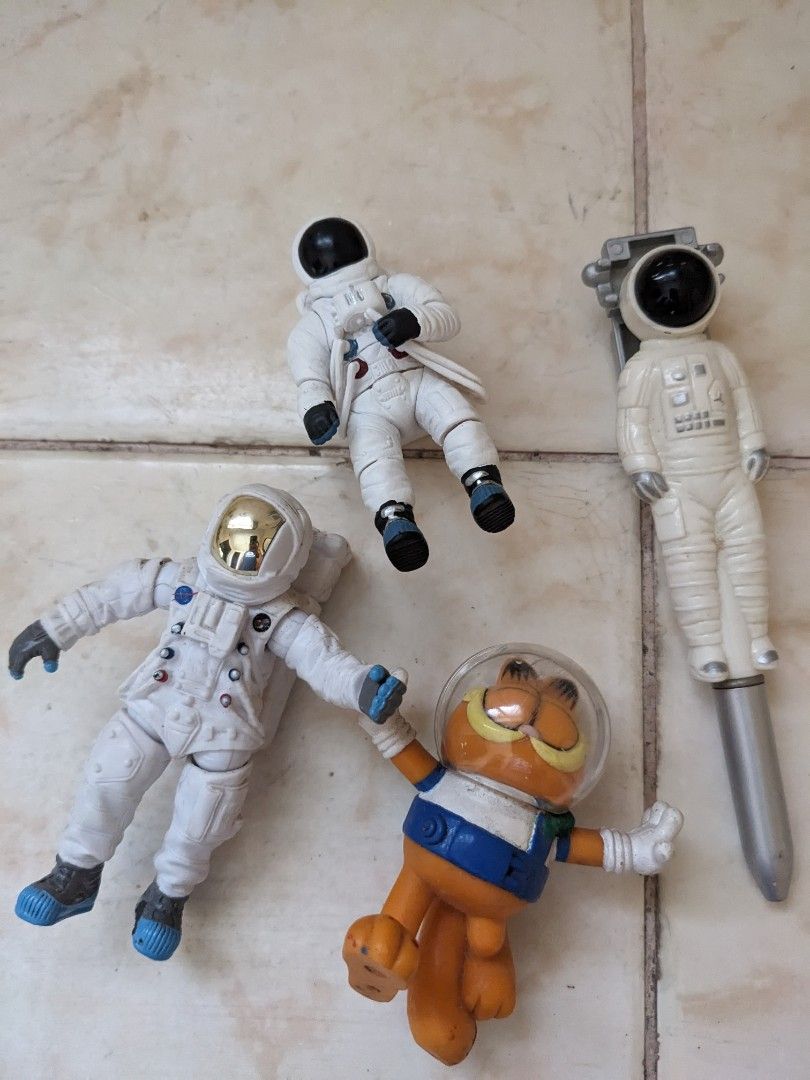 Take All Astronaut Figures (Category: Figurines & Statues) located in Goa. Submitted by sofiavill333 (Listing ID 1464999144, Image 1). Description: - Lot of 5 space-themed figures: 4 astronauts and 1 Garfield in a spacesuit - Includes 2 floating astronauts, 1 large articulated astronaut with a golden visor, and 1 astronaut pen clicker - Colorway: White, orange, and blue - Condition: Minor paint wear on some pieces due to previous play - Selling a