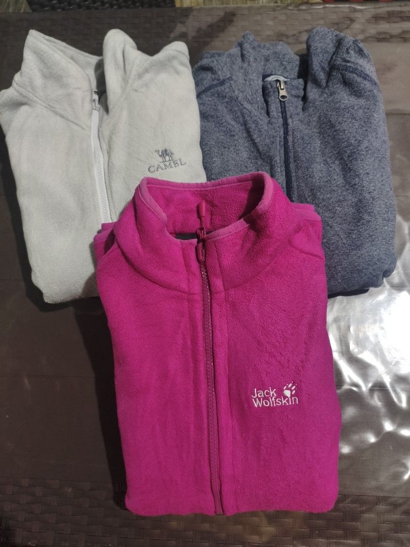 Take all Fleece Jacket ‼️‼️ (Category: Coats, Jackets and Outerwear) located in Baguio. Submitted by zayneshop (Listing ID 1465052972, Image 2). Description: - Set of 3 cozy zip-up fleece jackets - Includes: Pink Jack Wolfskin, Heather Blue, and Cream Camel (with embroidered logo) - Features warm high-neck collars and full front zippers - Soft and comfortable material, perfect for layering or outdoor activities - Excellent value bundle for cold w