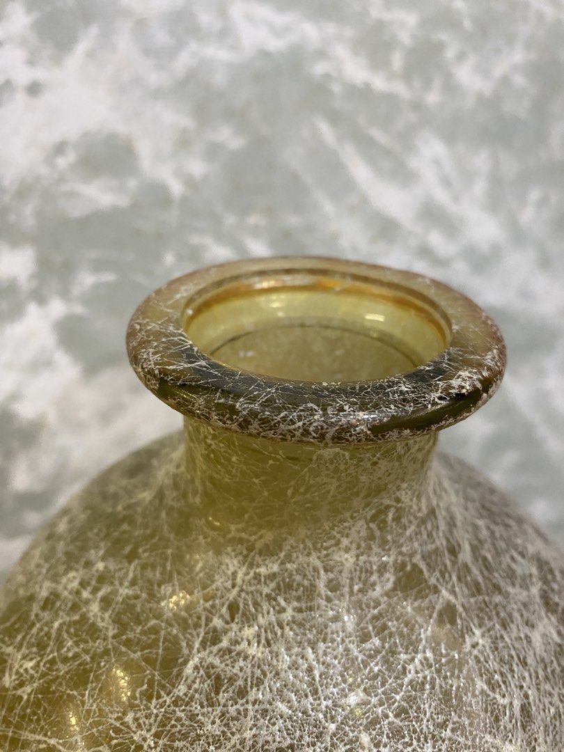 Tall Amber Textured Glass Decorative Vase (Category: Vases & Decorative Bowls) located in Calamba. Submitted by chebvintagedepot (Listing ID 1464992093, Image 3). Description: [T-B04-01] This tall amber glass vase has a textured, cobweb-like finish across its surface, giving it a naturally aged look. Its tall shape works well for displaying long-stemmed flowers, branches, or greenery. The warm amber color and textured surface give it a simple, na