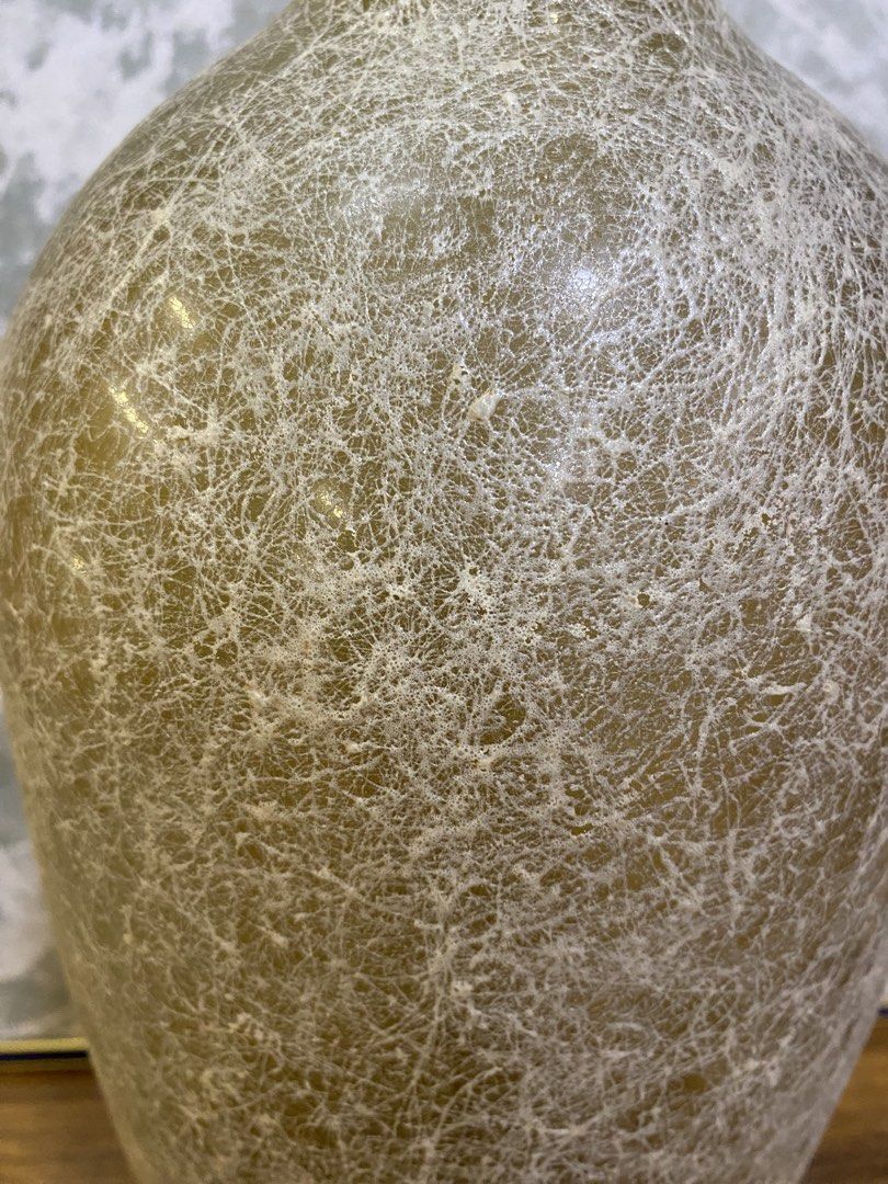 Tall Amber Textured Glass Decorative Vase (Category: Vases & Decorative Bowls) located in Calamba. Submitted by chebvintagedepot (Listing ID 1464992093, Image 2). Description: [T-B04-01] This tall amber glass vase has a textured, cobweb-like finish across its surface, giving it a naturally aged look. Its tall shape works well for displaying long-stemmed flowers, branches, or greenery. The warm amber color and textured surface give it a simple, na