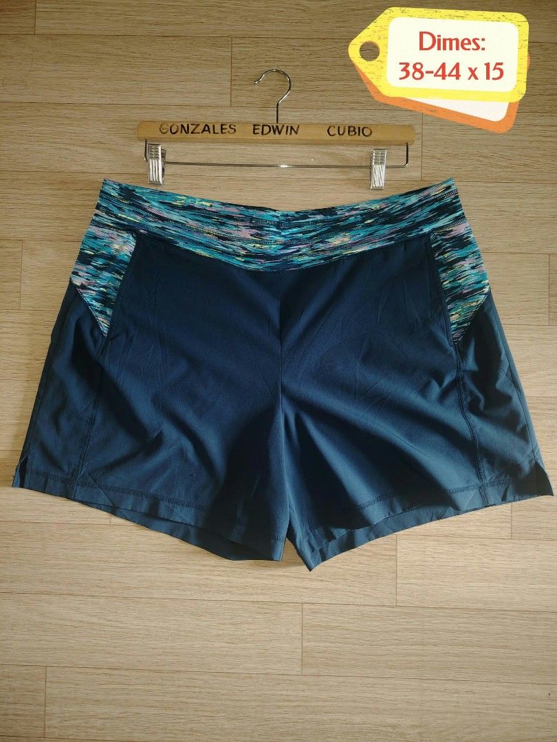 Target C9 Champion Athletic Shorts Navy Blue Multi (Category: Activewear) located in Nasipit. Submitted by edwingonzales498-69377 (Listing ID 1465074632, Image 1). Description: - Color: Dark blue with vibrant colorful patterned waistband and side accents - Material: Lightweight, durable fabric ideal for running and workouts - Fit: Secure elastic waistband fitting 38 to 44 inches - Length: 15 inches - Condition: Inside tag shows fading from washin