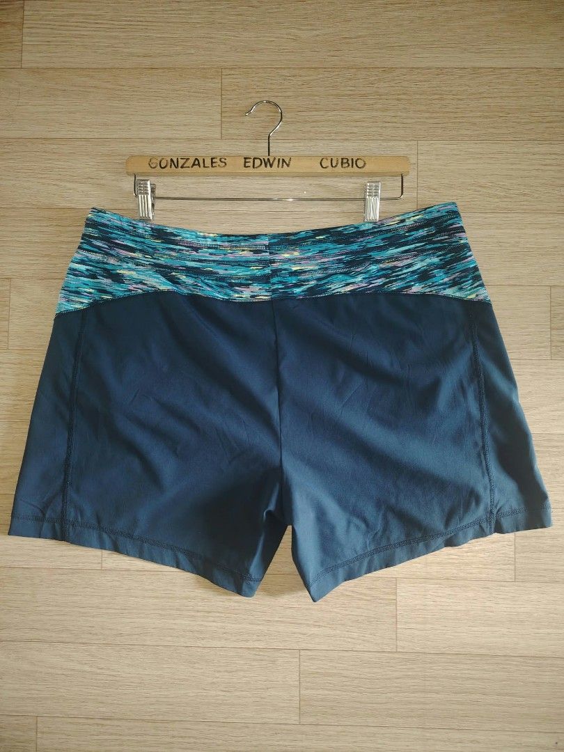 Target C9 Champion Athletic Shorts Navy Blue Multi (Category: Activewear) located in Nasipit. Submitted by edwingonzales498-69377 (Listing ID 1465074632, Image 3). Description: - Color: Dark blue with vibrant colorful patterned waistband and side accents - Material: Lightweight, durable fabric ideal for running and workouts - Fit: Secure elastic waistband fitting 38 to 44 inches - Length: 15 inches - Condition: Inside tag shows fading from washin