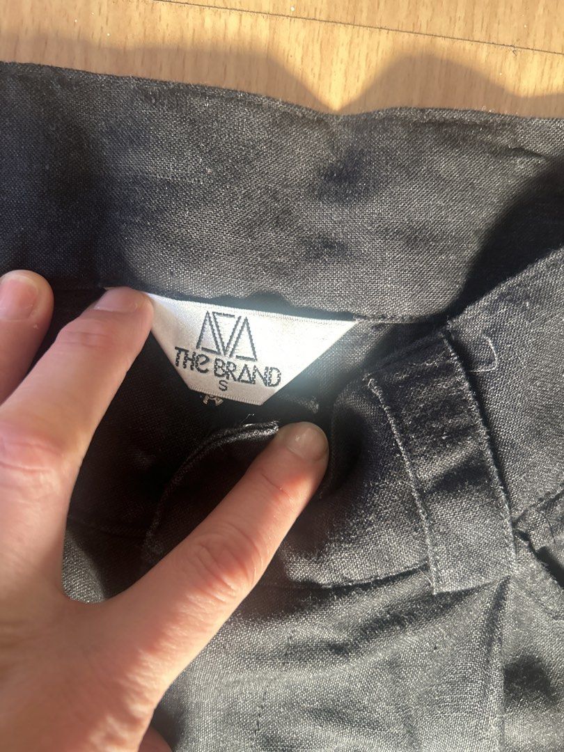 The Brand Black Cargo Pants Size S (Category: Jeans) located in Pasig City. Submitted by sevyenti (Listing ID 1465170624, Image 2). Description: - Brand: The Brand - Size: Small - Color: Black - Fit: High waist with belt loops, straight leg cut - Features: Utility pockets on both sides, lightweight fabric - Style: Versatile wardrobe staple, easy to pair with basic tees and tanks.