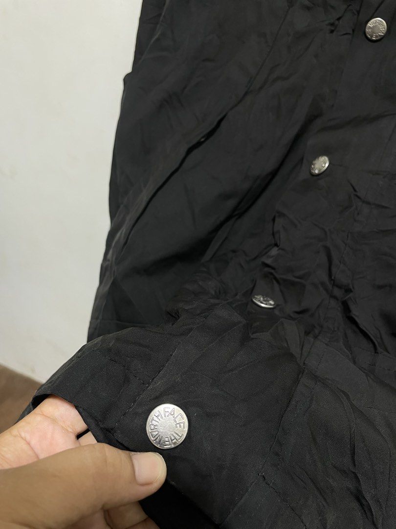 The North Face Black Gore-Tex Waterproof Jacket (Category: Coats, Jackets and Outerwear) located in Santiago. Submitted by UkayLuxxSelector (Listing ID 1465074164, Image 3). Description: - Brand: The North Face - Color: Solid black - Material: Waterproof Gore-Tex fabric - Hardware: YKK zippers with authenticity hologram patch - Closure: Full zip front with button storm flap - Fit: Standard fit - Features: Adjustable velcro cuffs, cinch cords at h
