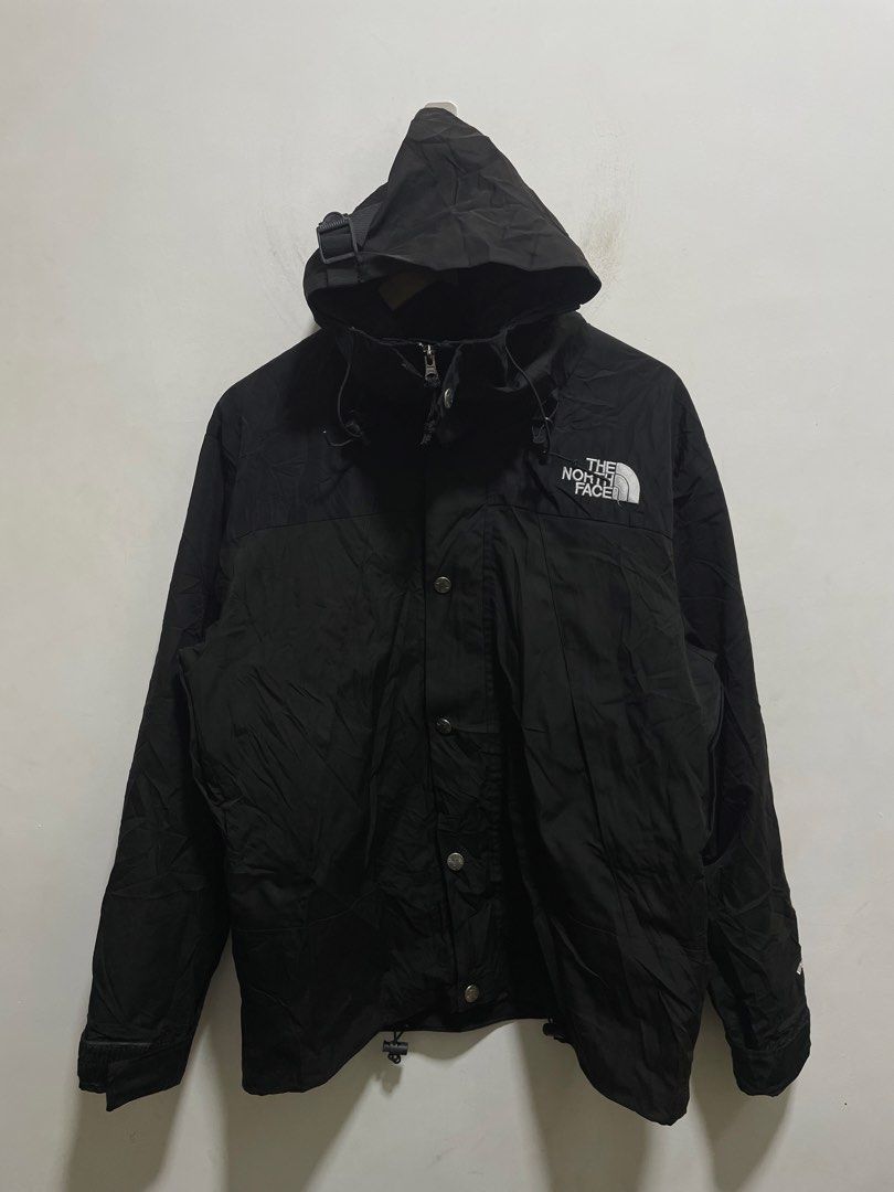 The North Face Black Gore-Tex Waterproof Jacket (Category: Coats, Jackets and Outerwear) located in Santiago. Submitted by UkayLuxxSelector (Listing ID 1465074164, Image 1). Description: - Brand: The North Face - Color: Solid black - Material: Waterproof Gore-Tex fabric - Hardware: YKK zippers with authenticity hologram patch - Closure: Full zip front with button storm flap - Fit: Standard fit - Features: Adjustable velcro cuffs, cinch cords at h