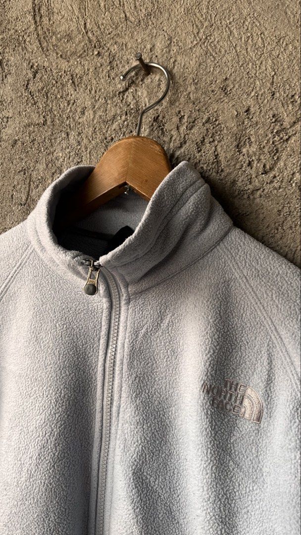 The North Face Light Blue Fleece Jacket (Category: Coats, Jackets and Outerwear) located in Cabuyao City. Submitted by bulandos (Listing ID 1465051121, Image 2). Description: - Brand: The North Face - Color: Light Blue - Size: Women's Medium - Material: Soft, warm, and comfortable fleece - Closure: Full zip with durable YKK hardware - Pockets: Two side zippered pockets - Details: Stand-up collar and embroidered chest logo - Condition: Excellent, 
