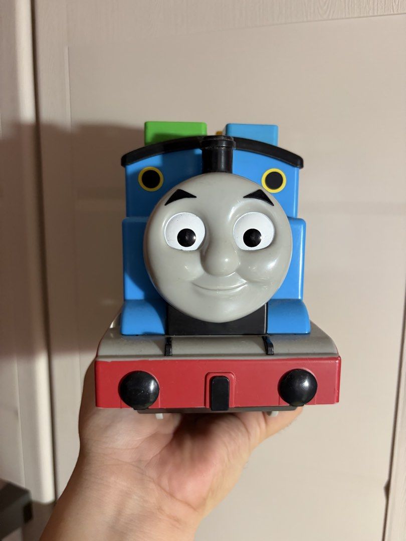 Thomas Shape Sorter (Category: Vehicle & Diecast Models) located in Plaridel. Submitted by moddedjarvis (Listing ID 1465170334, Image 2). Description: - Official Merchandise: Genuine Maruka Corp Thomas and Friends toy dated 2021 on the bottom - Classic Design: Iconic blue body, friendly face, black funnel, and multicolored blocks on the roof - Kid-Friendly: Standard toy size that is easy for little hands to push around - Condition: Clean, well-ma