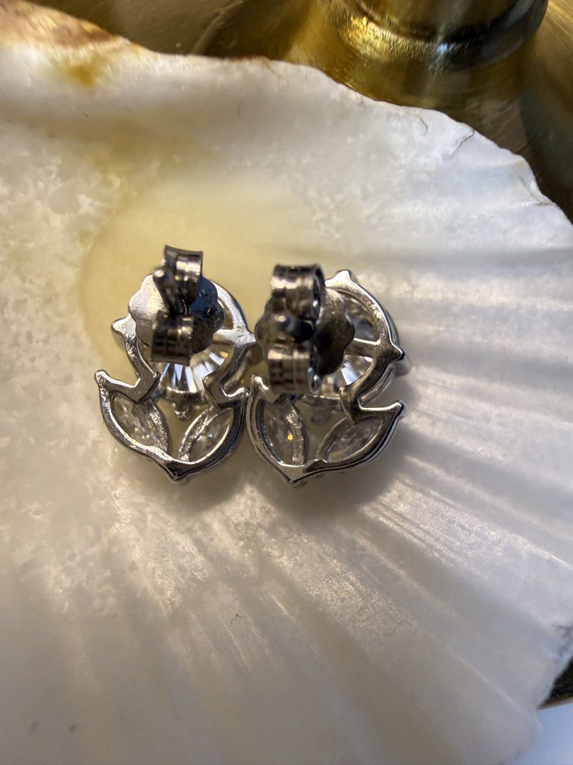 Three-stone Stud Earrings (Category: Earrings) located in Baguio. Submitted by mooi.kuryba (Listing ID 1465114233, Image 2). Description: Sparkle in Threes ✨ Elevate your style with our Three-stone Stud Earrings, featuring radiant D Color Moissanite stones for brilliance that never fades. Perfect for every occasion, perfect for you. 🤩 D Color Moissanite | Round Brilliant 💎 Brand New in S925 ✨ 4 CT total weight per pair 💎 With 2 marquise-cut ac