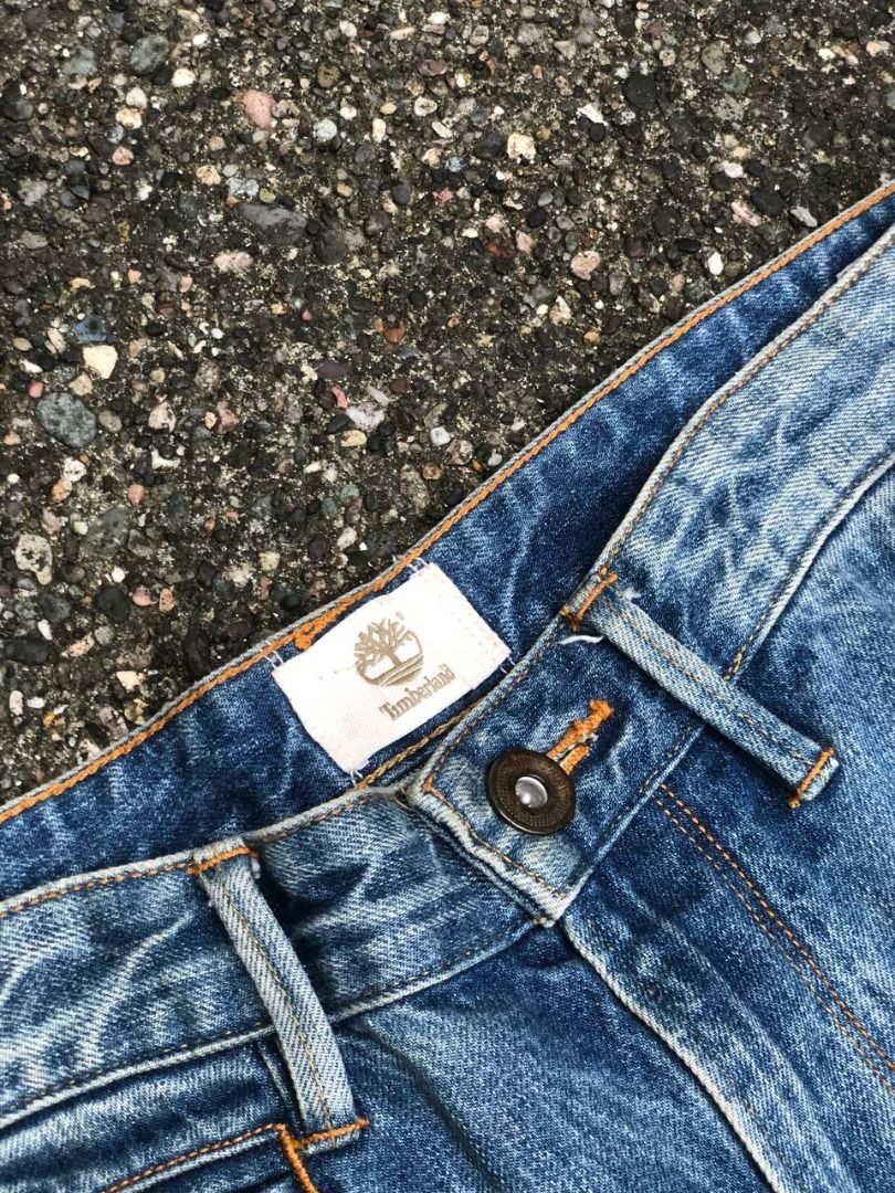 Timberland Light Blue Denim Jeans (Category: Jeans) located in Tacloban City. Submitted by thedropout (Listing ID 1465052316, Image 3). Description: - Brand: Timberland - Color: Blue denim - Style: Classic five-pocket styling with zip fly and metal button closure - Details: Leather brand patch on back waistband and inside brand label at front fly - Condition: Great everyday piece with a notable dark stain near the hem on one leg - Perfect for dai