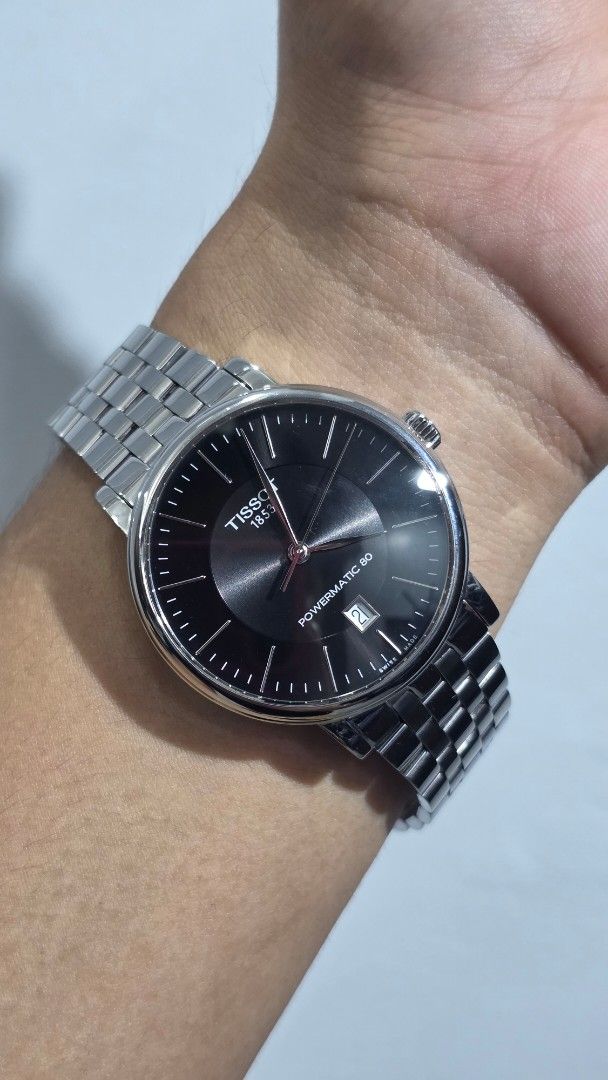 Tissot Carson Premium Black Dial (40mm) (Category: Men's Watches) located in Calamba. Submitted by dmnd.pr (Listing ID 1465055823, Image 3). Description: - Brand/Model: Tissot Carson Premium Automatic Watch - Movement: Powermatic 80 - Dial & Details: Black dial with date window near the edge - Bracelet: Stainless steel bracelet with minimal signs of wear - Inclusions: Original black and red box, warranty card, and quick start guide - Condition: E