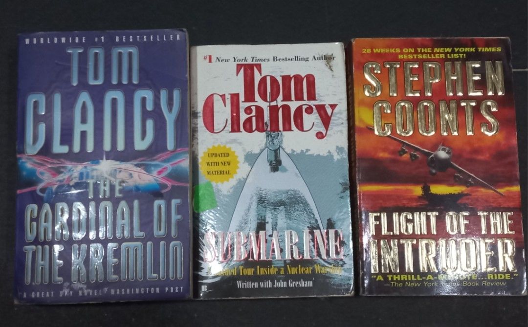 Tom Clancy and Stephen Coonts bundle (Category: Storybooks) located in Manila. Submitted by seller913 (Listing ID 1465031207, Image 1). Description: - Set of 3 action-packed thriller paperbacks - Includes: The Cardinal of the Kremlin and Submarine (Tom Clancy), plus Flight of the Intruder (Stephen Coonts) - Perfect for fans of espionage and military fiction - Standard paperback sizes - Condition: Shows minor shelf wear and old price stickers - Se