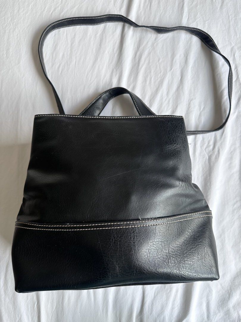 Tommy Hilfiger Tote / Shoulder Bag (Category: Cross-body Bags) located in Tarlac. Submitted by inlovewithbagsph (Listing ID 1465094944, Image 1). Description: Black leather/leather-look body with contrast stitching Short top handles Long shoulder strap Silver-tone hardware Soft/slouchy rectangular tote silhouette.