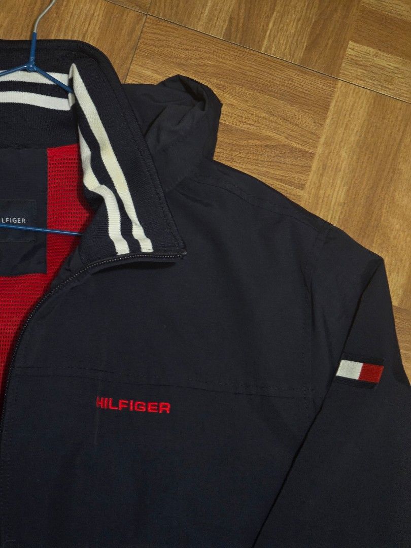Tommy Hilfiger Windbreaker (Category: Coats, Jackets and Outerwear) located in Manila. Submitted by gilbert0522 (Listing ID 1465054055, Image 3). Description: • Navy blue TH windbreaker • Color rate: 10/10 • Issue: None • Size: 23x28 • NEGOTIABLE TO SURE BUYER YOU CAN CHECK MY OTHER LISTINGS 👕 All Authentic/Original Preloved from South Korea 📍Sampaloc, Manila 🚚 JNT/Lalamove.