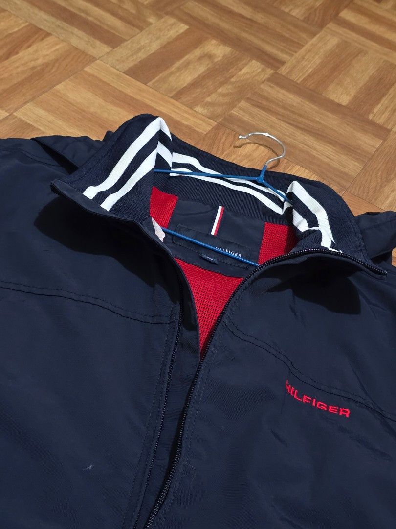 Tommy Hilfiger Windbreaker (Category: Coats, Jackets and Outerwear) located in Manila. Submitted by gilbert0522 (Listing ID 1465054055, Image 2). Description: • Navy blue TH windbreaker • Color rate: 10/10 • Issue: None • Size: 23x28 • NEGOTIABLE TO SURE BUYER YOU CAN CHECK MY OTHER LISTINGS 👕 All Authentic/Original Preloved from South Korea 📍Sampaloc, Manila 🚚 JNT/Lalamove.