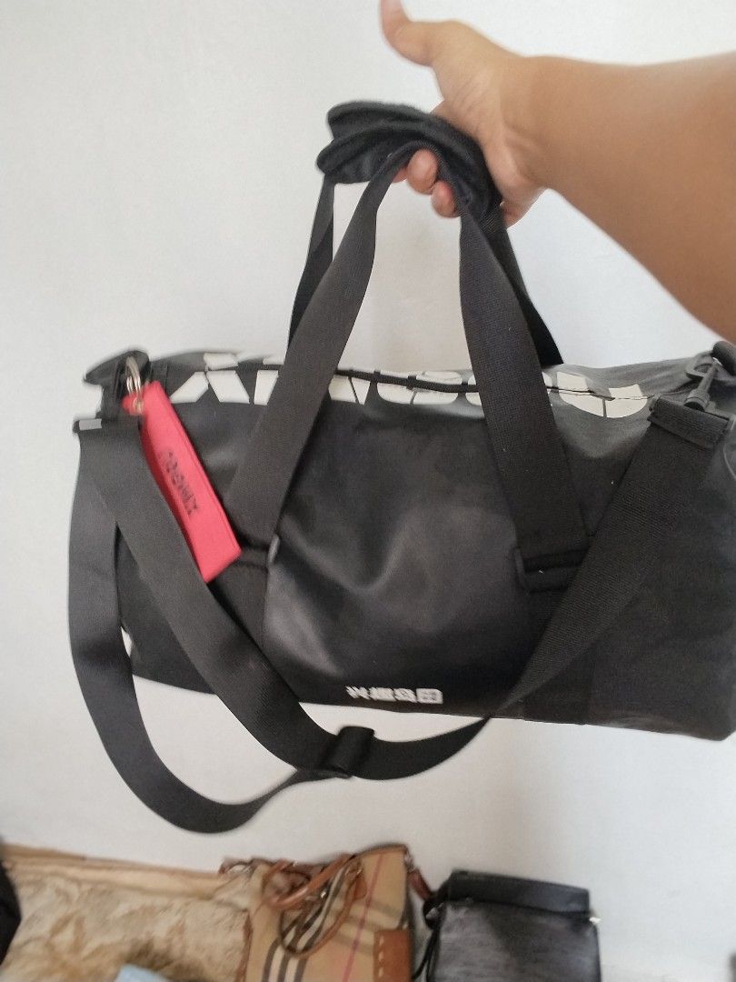 Travel bag/ gym bag (Category: Belt bags, Clutches and Pouches) located in Cavite. Submitted by bagssection04 (Listing ID 1465013519, Image 2). Description: Travel bag or Gym bag drak gray color large size like new condition.