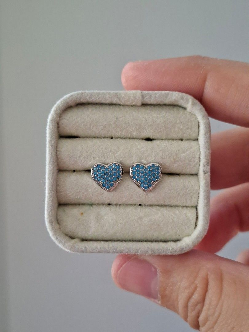 Turquoise Stones in Silver Heart Stud Earrings (Category: Earrings) located in Dasmarinas. Submitted by danabrie22 (Listing ID 1465010215, Image 1). Description: very well-made, excellent crafstmanship 10/10 condition brand new stainless steel & turquoise-colored cubic zirconia stones made in Hongkong.
