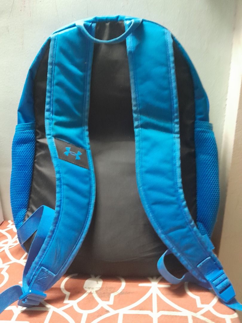 Under Armour Blue Backpack with Bungee Cords (Category: Backpacks) located in Bontoc. Submitted by younghustler101 (Listing ID 1465074050, Image 1). Description: - Brand: Under Armour - Color: Bright blue with a solid black back panel - Storage: Handy front elastic bungee cord system and mesh side pockets for water bottles - Comfort: Comfortable padded shoulder straps - Use: Durable everyday bag ideal for school, gym, or casual use.