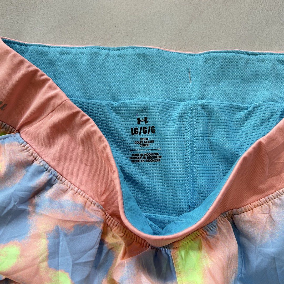 Under Armour Iso-Chill short 🔥 (Category: Shorts) located in Jinoba-an. Submitted by eegiboy (Listing ID 1465007173, Image 2). Description: - Brand: Under Armour - Size: Large - Design: Bright pink and blue tie-dye outer shell with built-in turquoise compression shorts - Technology: Iso-Chill waistband to disperse body heat and keep you cool - Fit: Fitted design with a lightweight feel - Details: White UA logo near the hem - Condition: Great for