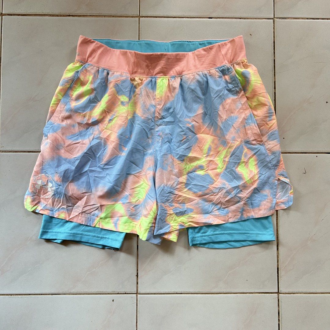 Under Armour Iso-Chill short 🔥 (Category: Shorts) located in Jinoba-an. Submitted by eegiboy (Listing ID 1465007173, Image 1). Description: - Brand: Under Armour - Size: Large - Design: Bright pink and blue tie-dye outer shell with built-in turquoise compression shorts - Technology: Iso-Chill waistband to disperse body heat and keep you cool - Fit: Fitted design with a lightweight feel - Details: White UA logo near the hem - Condition: Great for