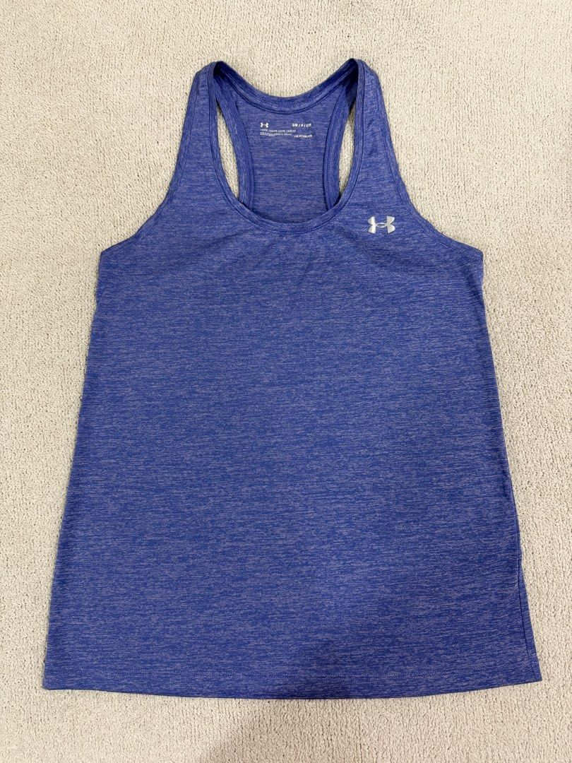 Under Armour Running Top S (Category: Activewear) located in Subic. Submitted by kittysclosetsale (Listing ID 1465007269, Image 1). Description: - Brand: Under Armour - Color: Heather Blue - Size: Small (Loose Fit) - Material: HeatGear fabric (ideal for workouts & training) - Design: Racerback with silver UA logos on chest and upper back - Condition: Clean, tagless printed collar.