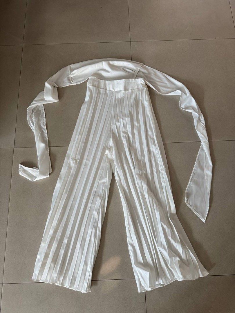Underground Designer White Pleated Pants With Matching Top Set (Category: Sets or Coordinates) located in Taguig. Submitted by anxmz (Listing ID 1465043141, Image 1). Description: - 2 piece set - Brand: Underground Designer - Color: Solid white - Set includes: Pleated wide-leg pants and top with long wrap ties - Fabric: Lightweight and comfortable - Versatile: Wear together as a set or mix and match with other pieces - Occasion: Great for casual 