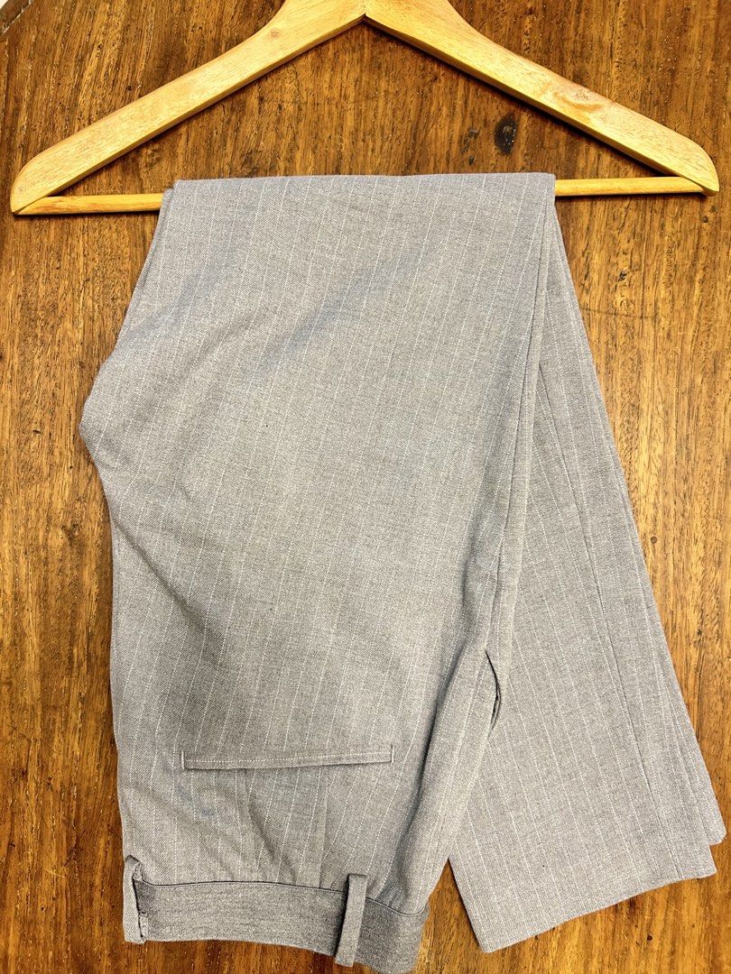 Uniqlo Ankle Pants (Category: Other Bottoms) located in Antipolo. Submitted by tshopph (Listing ID 1465043326, Image 1). Description: ✨ Super comfortable fabric with a clean, tailored pinstripe look ✨ Includes an elastic back waistband for a flexible fit and belt loops for easy styling ✨ Functional side pockets and back welt pockets ✨ Perfect for office workwear, smart-casual outfits, or everyday casual looks ✨ Color/Pattern: Grey with white pins